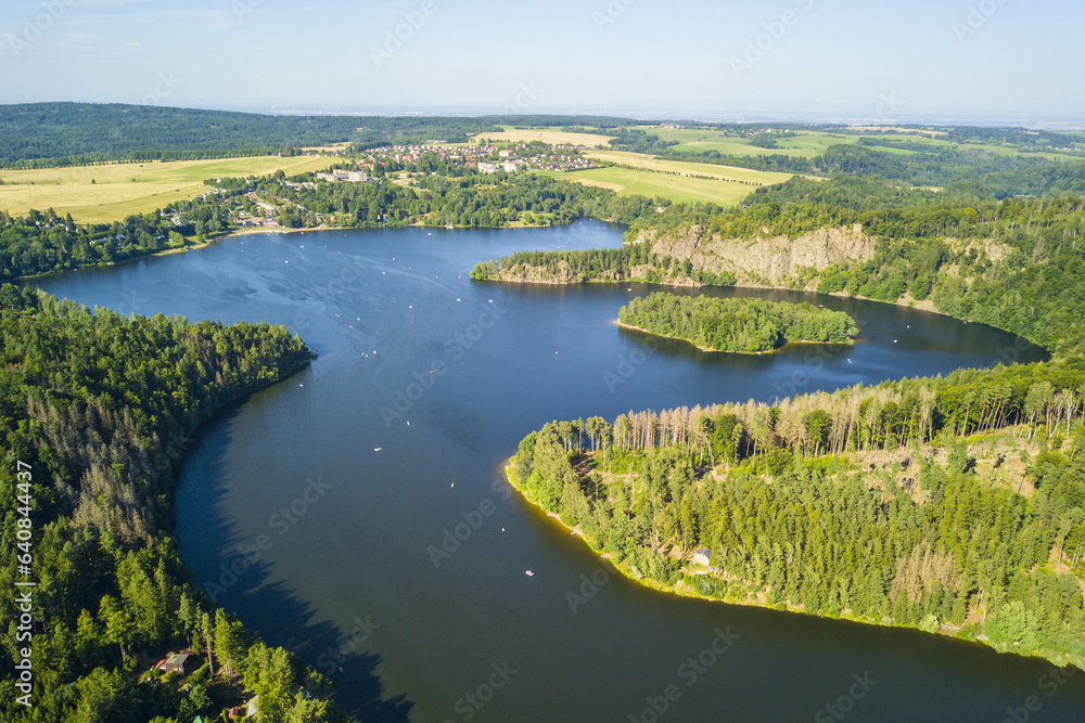 Fototapeta premium Aerial view of lake Sec with beautiful island. Famous tourist destination in Pardubicky kraj, Czech republic, European union.