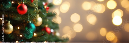 Merry Christmas and Happy New Year. Festive bright beautiful background. Decorated Christmas tree on blurred background. de-focused lights  gold bokeh