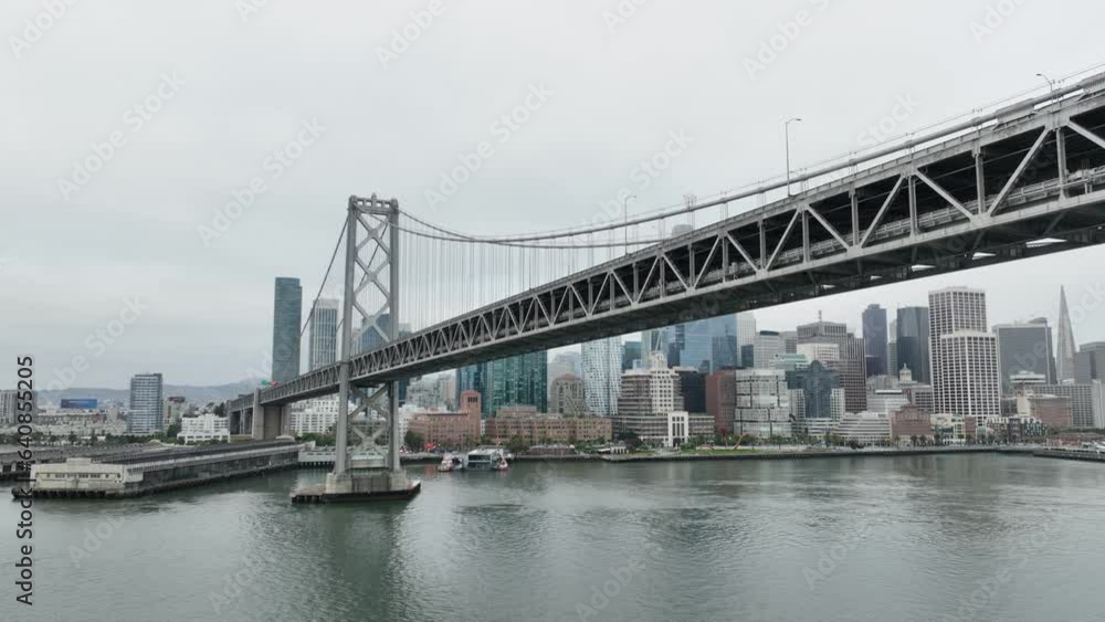 Aerial of the bay bridge and downtown San Francisco Skyline on an overcast and gray morning. Aerial of the bay bridge and downtown San Francisco Skyline on an overcast and gray morning.