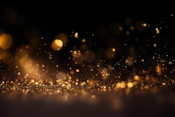 Abstract gold shiny Christmas background with bokeh. Holiday bright golden dust. Blurred backdrop with particles.