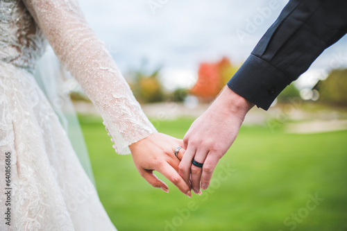 Bride and Groom holding hands on their wedding day