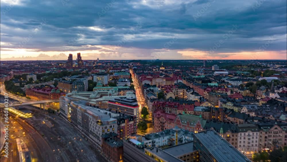 Fly above evening city. Transport infrastructure and popular landmarks at sunset. hyperlapse shot of metropolis. Stockholm, Sweden