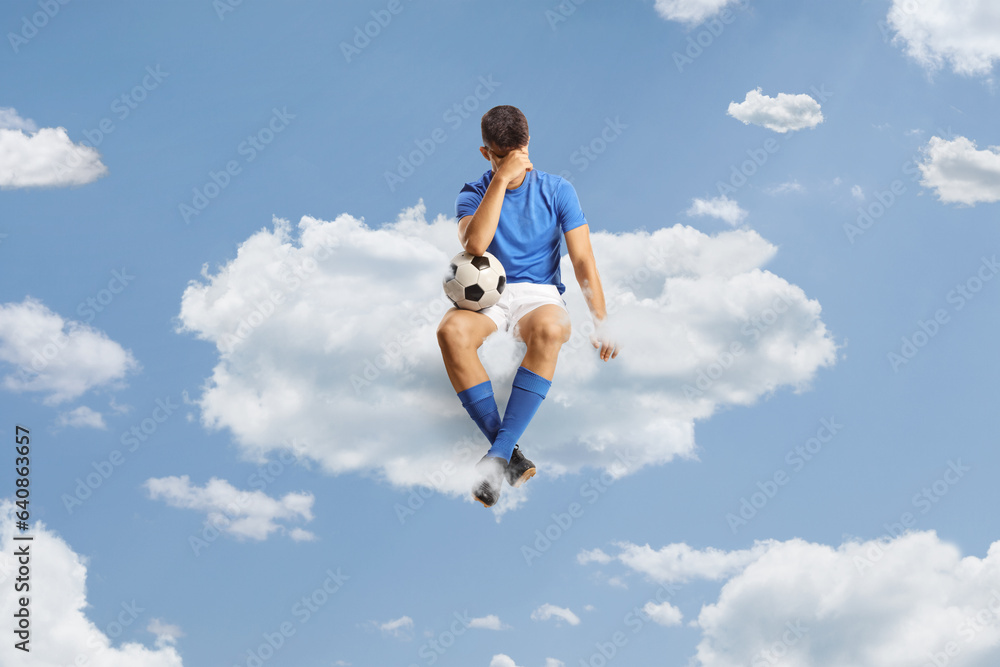 Sad football player sitting on a cloud Sad football player sitting on a cloud