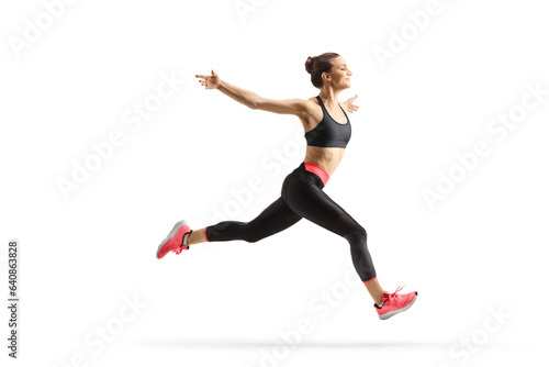 Full length profile shot of a fit young woman running and spreading arms © Ljupco Smokovski