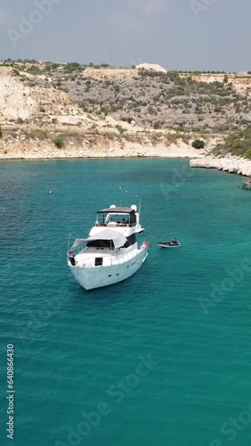 Drone shot of a white yact sailing off the coast of Turkey. photo