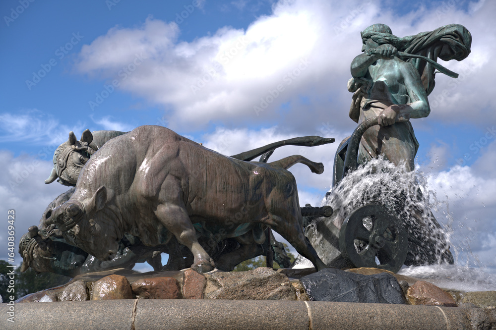 Gefion Fountain famous landmark in Copenhagen, Norse goddess Gefjon on a plow pulled by oxen, in Nordre Toldbod Copenhagen Gefion Fountain famous landmark in Copenhagen, Norse goddess Gefjon on a plow pulled by oxen, in Nordre Toldbod Copenhagen