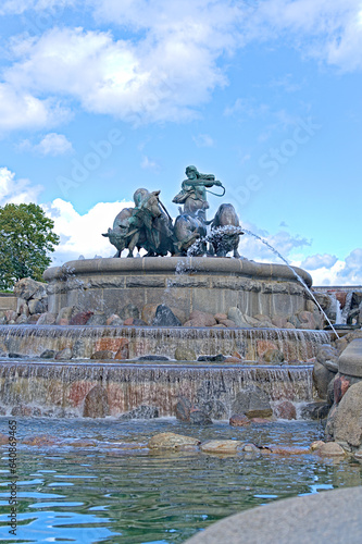 Gefion Fountain famous landmark in Copenhagen, Norse goddess Gefjon on a plow pulled by oxen, in Nordre Toldbod Copenhagen photo