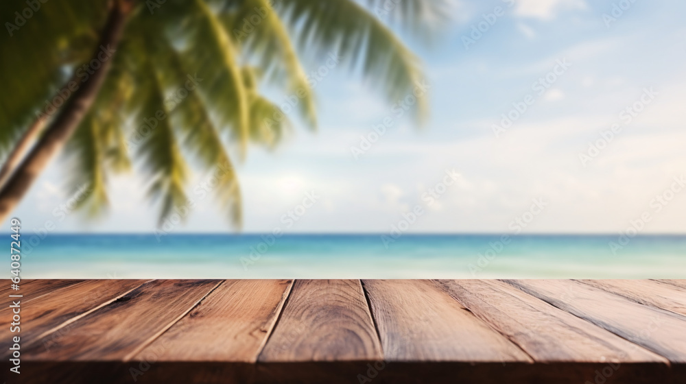 Fototapeta premium empty wooden table top with blur background of beach with palm tree for product display