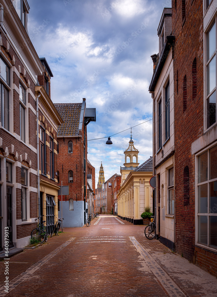 Empty street of Groningen city, Netherlands, Europe. A paved red brick street.