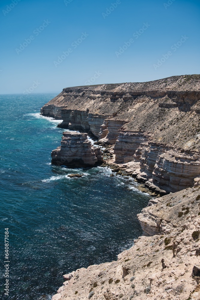 Kalbarri National Park Coastal Cliffs. Impressive coastal cliffs in Kalbarri National Park, Western Australia. Massive and high cliffs at the coastline of Western Australia. Stunning seascape scene. Kalbarri National Park Coastal Cliffs. Impressive coastal cliffs in Kalbarri National Park, Western Australia. Massive and high cliffs at the coastline of Western Australia. Stunning seascape scene.