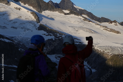 Mountaineers taking photos in the alps 
