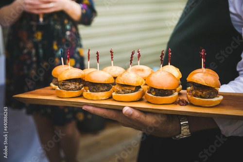 Delicious mini hamburger sliders being served