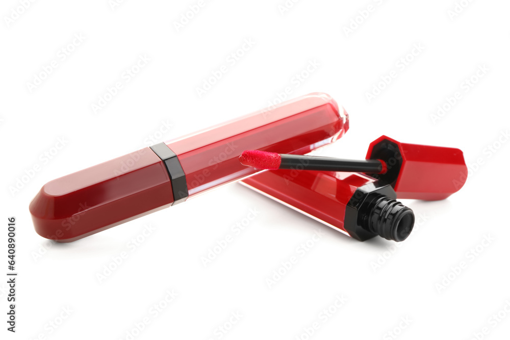 Beautiful liquid red lipsticks in different shades on white background Beautiful liquid red lipsticks in different shades on white background