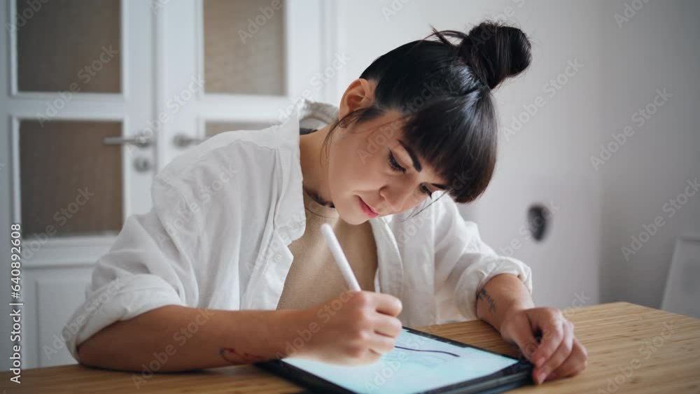 Focused woman sketching tablet home workplace closeup. Artist using graphic pad Focused woman sketching tablet home workplace closeup. Artist using graphic pad