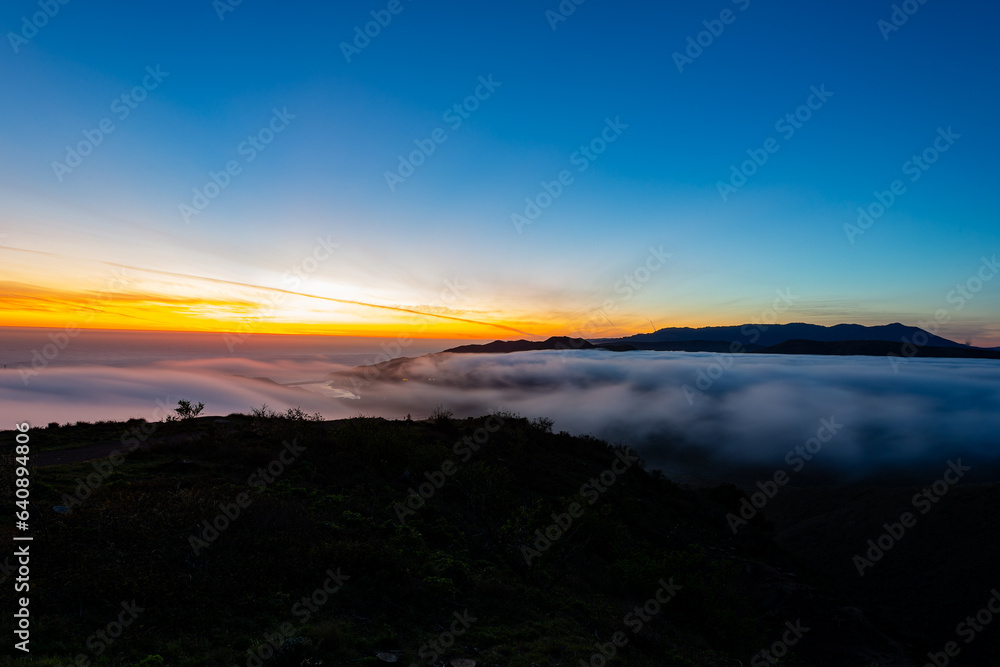Twilight aerial view of mountain with fog