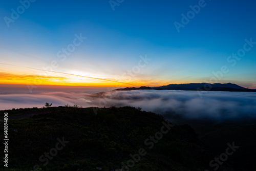 Twilight aerial view of mountain with fog