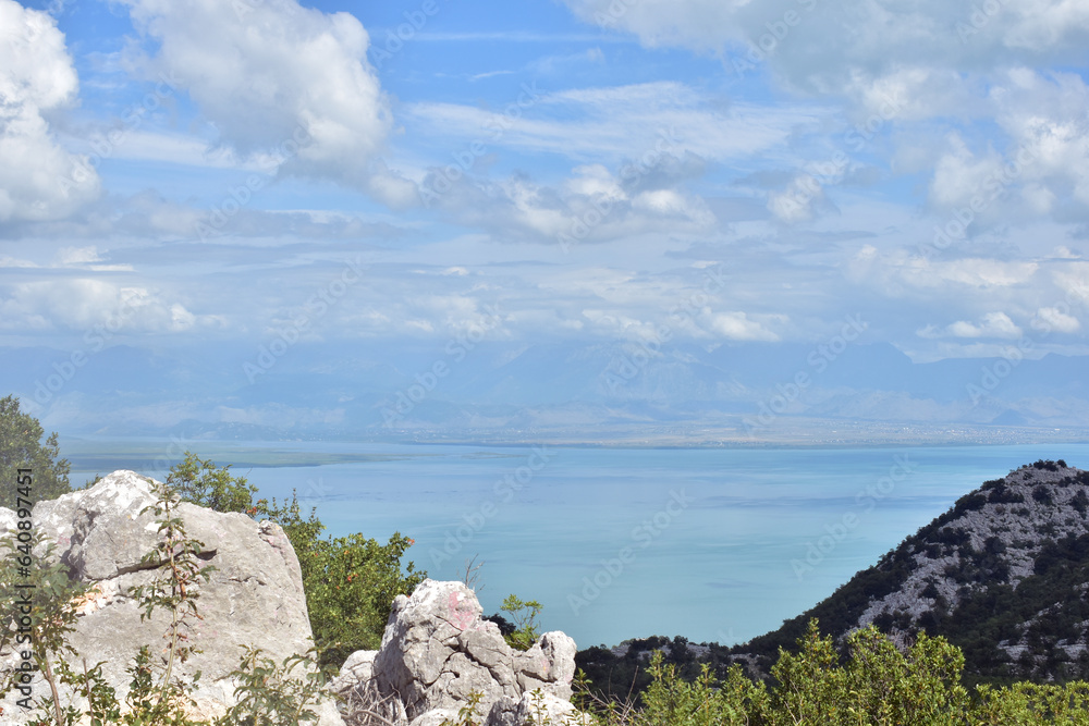 Lake Skadar panorama on a sunny and cloudy day. Beautiful background photo with copy space of Montenegro wild beauty. Lake view on summer. 