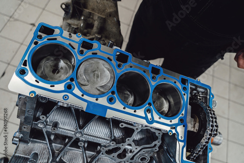 Photography Installing a new cylinder head gasket in the engine