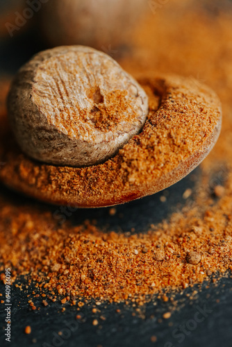 Tableau sur toile Nutmeg whole and nutmeg powder on a black background