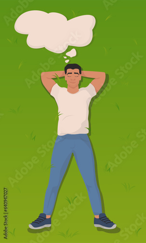 Man with closed eyes lying on green grass, empty thought bubble near her, top view. State of mindfulness