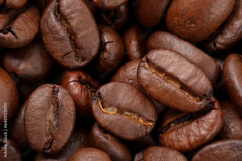 Aromatic roasted coffee beans as background, top view Aromatic roasted coffee beans as background, top view