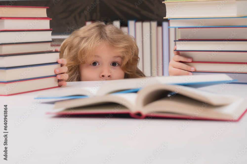 School bullying. Education Concept. Kid reads books in the library. Schoolboy with book in school library. Literature for reading. School bullying. Education Concept. Kid reads books in the library. Schoolboy with book in school library. Literature for reading.