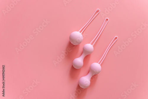 Pink balls for special exercises for woman. Balls for intimate muscles of women. Kegel balls for strenthening the pelvic floor muscles, vaginal muscles. Mock up. Close up