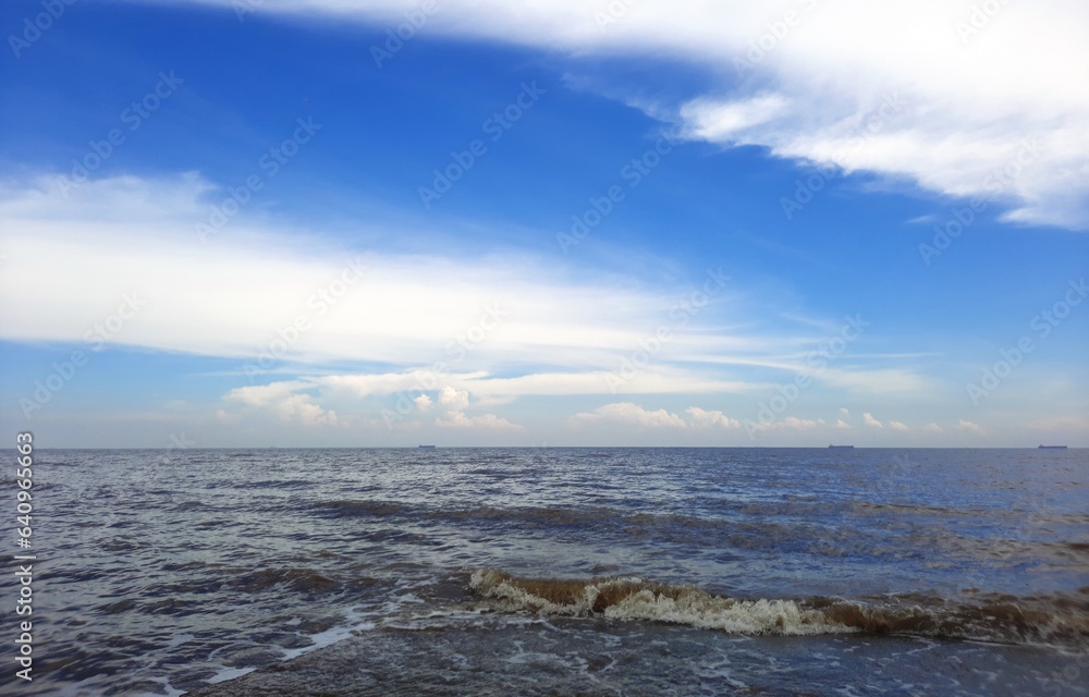 Fototapeta premium open sea with cloudy blue sky