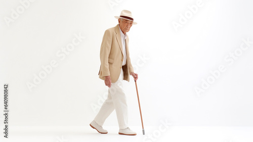Asian senior man with a cane walking