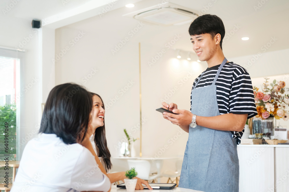 Smiling waiter take order talk to clients cafe restaurant visitors serving staff good customer service. Smiling waiter take order talk to clients cafe restaurant visitors serving staff good customer service.
