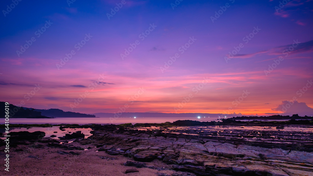 Sawarna beach,west Java,Indonesia, beautiful beach with coral reefs dotted with greenery Sawarna beach,west Java,Indonesia, beautiful beach with coral reefs dotted with greenery
