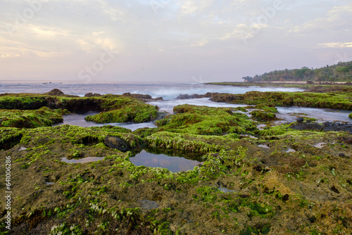 Sawarna beach west Java Indonesia  beautiful beach with coral reefs dotted with greenery 