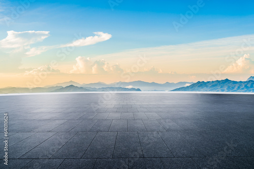 Empty square floor and mountain natural scenery at sunrise