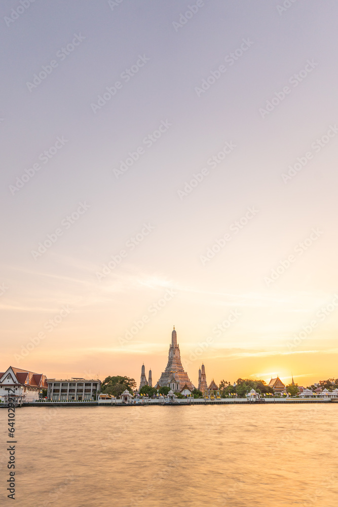 Wat Arun Temple during Sunset at Chao Praya River Bangkok, Thailand.