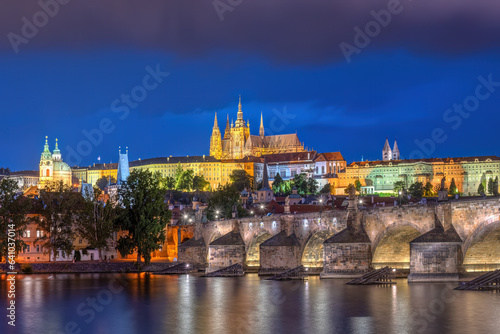 The imposing St. Vitus Cathedral and the Charles Bridge in Prague at night