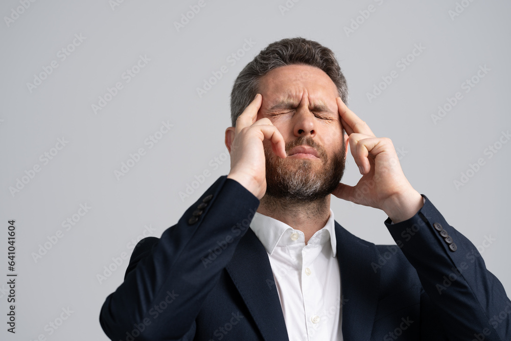 Businessman in suit with headache. Businessman with stress and burnout. Business man got migraine touch head because of pain. Headache and strain. Headache, tiredness and stress Businessman in suit with headache. Businessman with stress and burnout. Business man got migraine touch head because of pain. Headache and strain. Headache, tiredness and stress