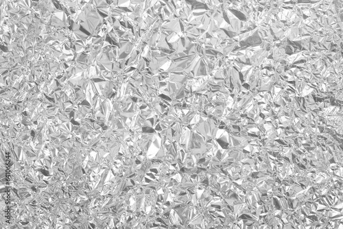 Silver foil leaf shiny texture, abstract grey wrapping paper for background and design art work.