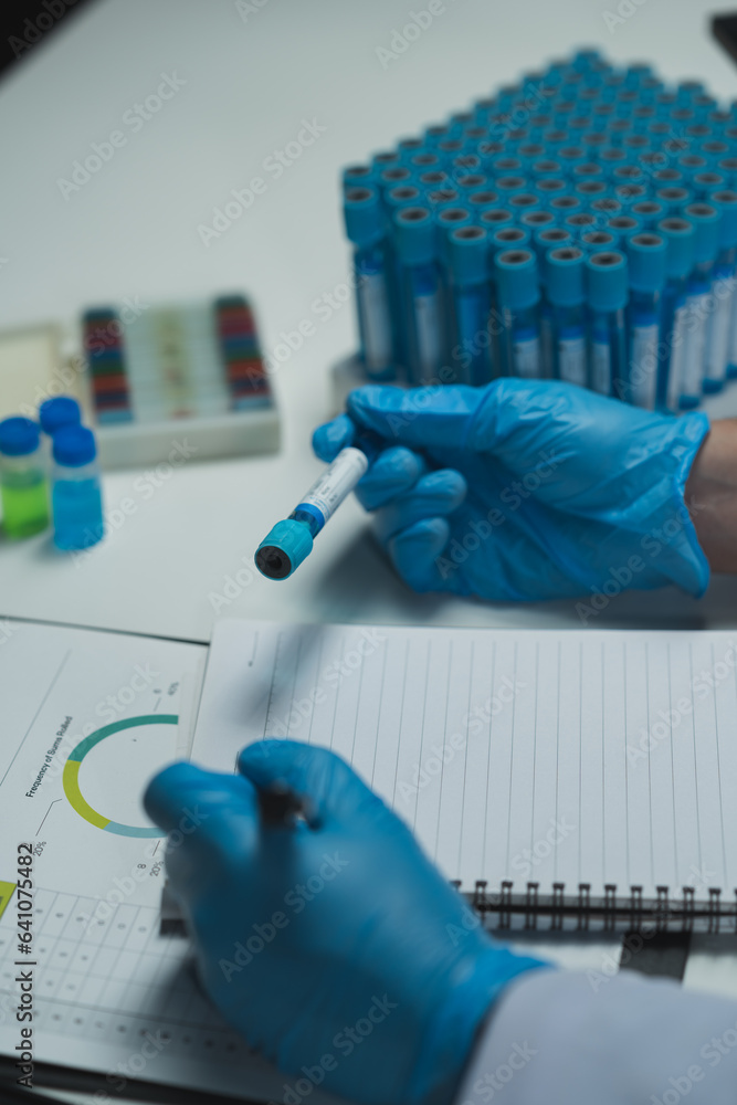 medical research laboratory Asian male scientist working using digital tablet analyze the sample record biochemical data medical science laboratory development of microbiology advanced equipment. medical research laboratory Asian male scientist working using digital tablet analyze the sample record biochemical data medical science laboratory development of microbiology advanced equipment.