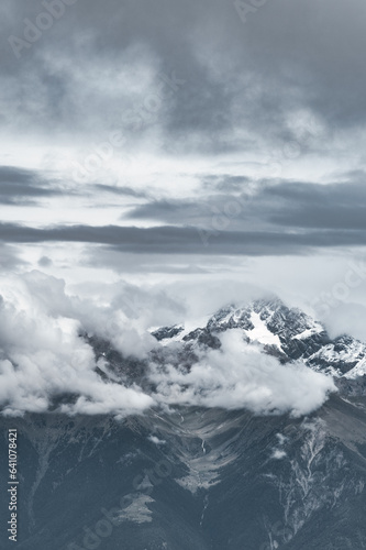 Fototapeta Naklejka Na Ścianę i Meble -  Gray mountain vertical landscape com clouds