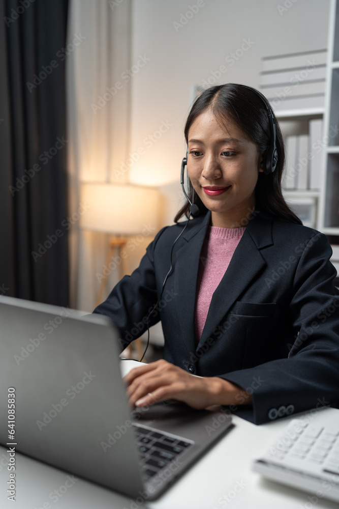 Asia call center with headset and microphone working on laptop Female entrepreneurs serving customers, business information, inquiries Support call center representatives help customers. Asia call center with headset and microphone working on laptop Female entrepreneurs serving customers, business information, inquiries Support call center representatives help customers.