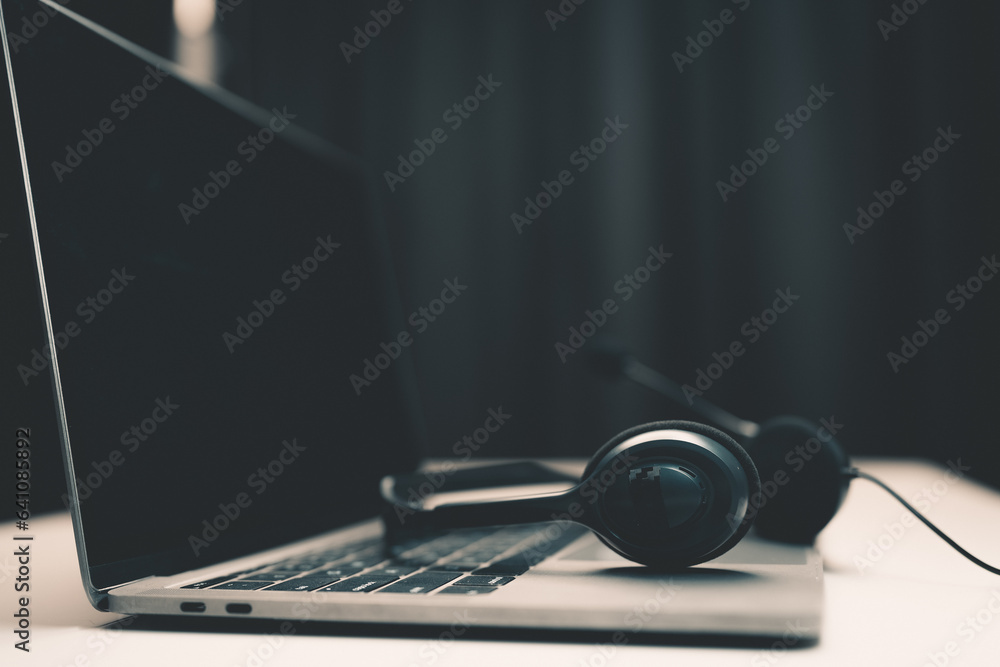 picture of equipment on the desk computer laptop headset for work Chat and inquire online concept of a call center and customer service office. picture of equipment on the desk computer laptop headset for work Chat and inquire online concept of a call center and customer service office.