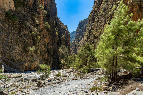 A dry, rocky river bed at the bottom of a deep gorge in the middle of a dry, hot summer (Samaria Gorge, Crete)