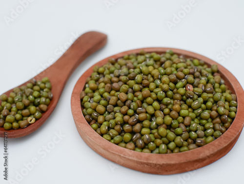 green bean seeds on a wooden plate