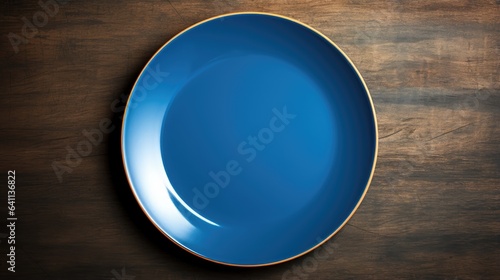 empty blue plate on wooden table