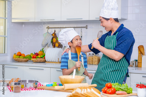 father and son cooking