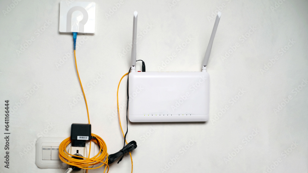 Wi-Fi router with two antennas on the wall. Technology concept. Wi-Fi router with two antennas on the wall. Technology concept.