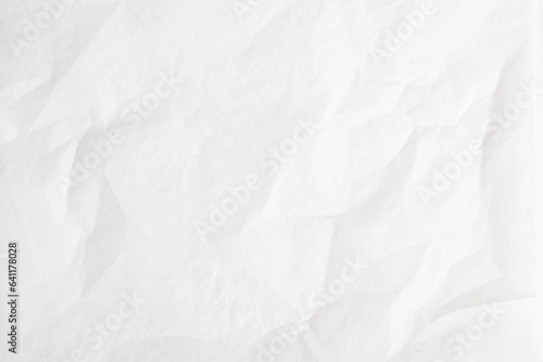 einfaches, simples Seidenpapier, Papier weiß mit leichten Knicken Falten und Struktur als Hintergrund, Background. photo