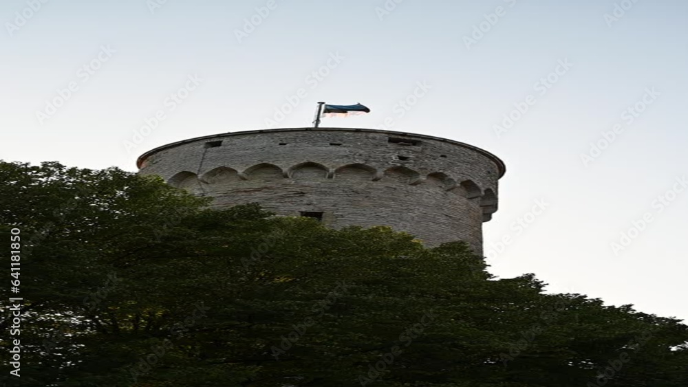 Tallinn, Estonia - August 29, 2023: Estonia flag on main Pikk Herman tower at summer night before sunset Tallinn, Estonia - August 29, 2023: Estonia flag on main Pikk Herman tower at summer night before sunset