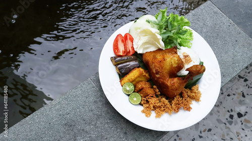 Indonesian fried chicken with rice