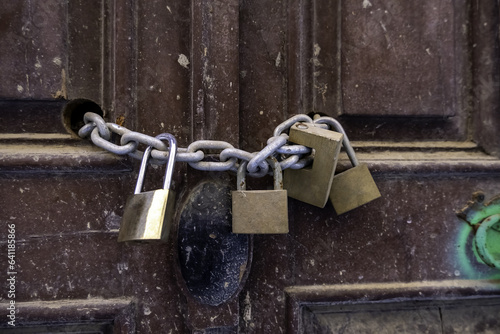 Old padlocks closed with chain